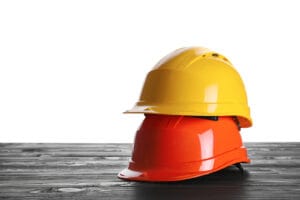 bigstock Different Hard Hats On Wooden 427133606