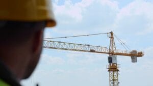 Big Construction Crane Working At Construction Site Outdoor On B